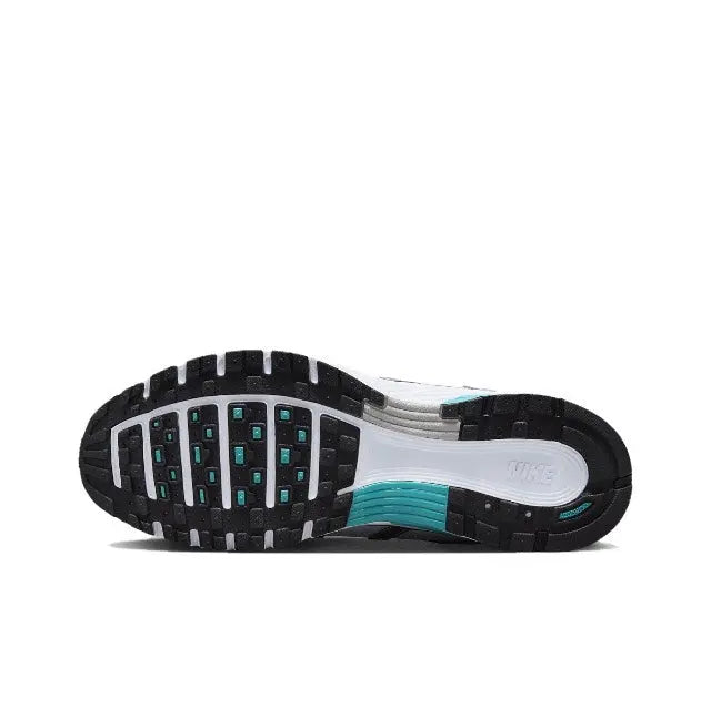 Nike P-6000 outsole view with white midsole and teal-blue traction pods