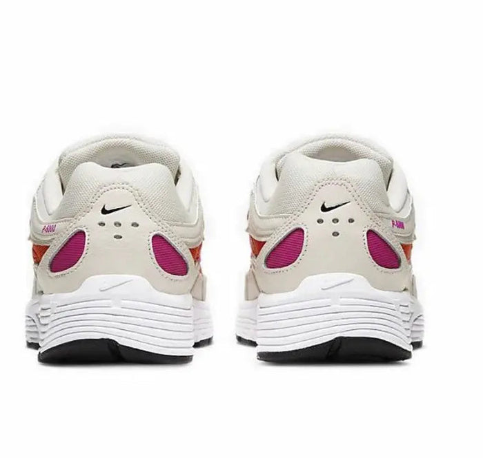 White running sneaker heel view with purple accents, lace-up back, and padded collar