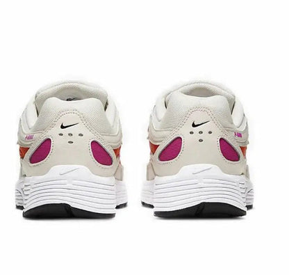 White running sneaker heel view with purple accents, lace-up back, and padded collar