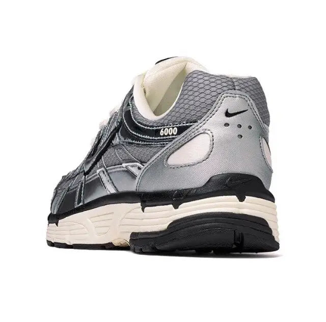 Nike P-6000 Premium sneakers with mesh collar, silver panels, and cream tongue