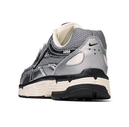 Nike P-6000 Premium sneakers with mesh collar, silver panels, and cream tongue
