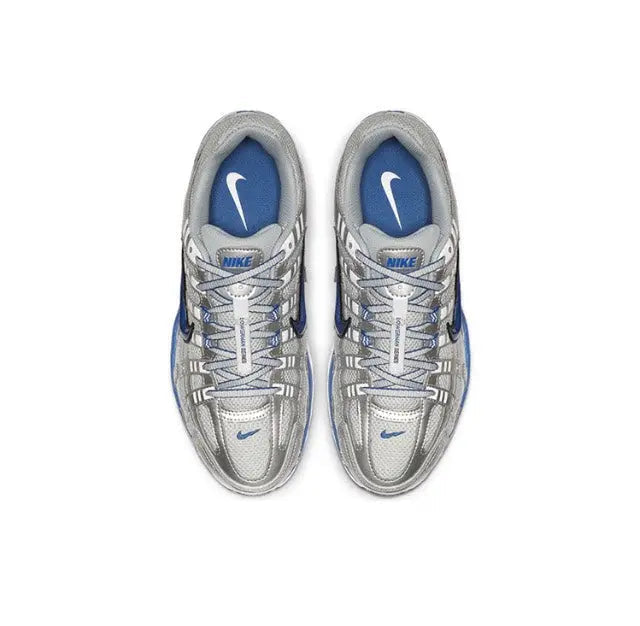 Nike running shoes, silver laces and panels with blue lining, front view pair.