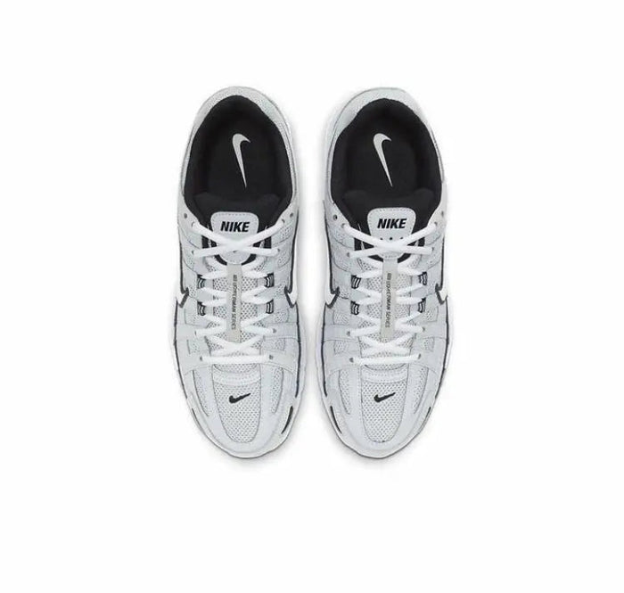 Pair of gray Nike P-6000 sneakers with white laces and black accents