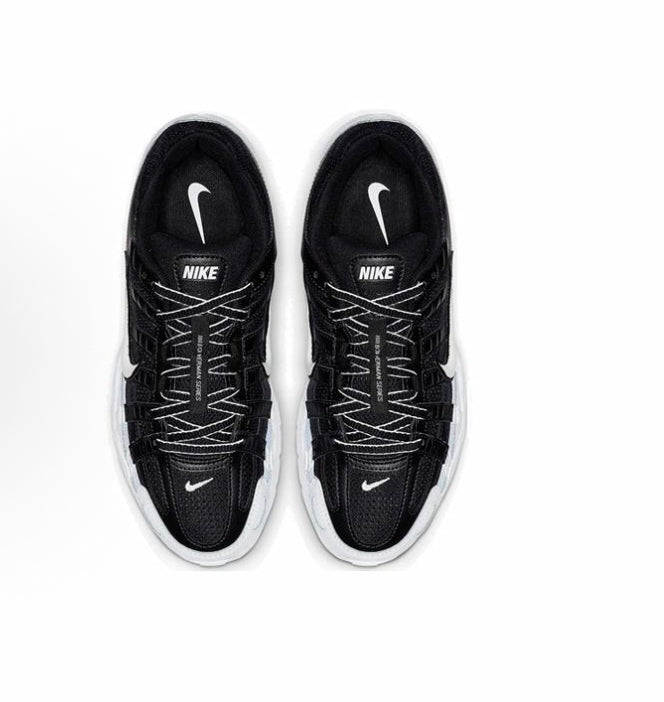 Black Nike sneakers with knit texture, swoosh, and Nike logo on tongue