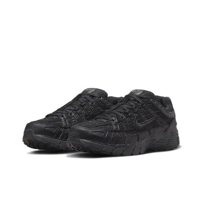 Black P-6000 sneaker side view with layered panel design and rubber sole