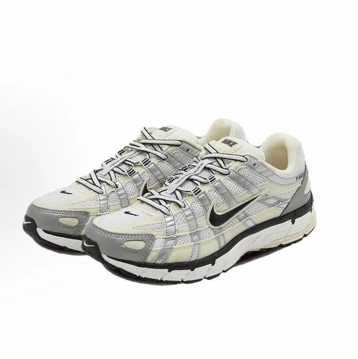 Nike P-6000 premium running sneakers in light gray, cream, and black, front view