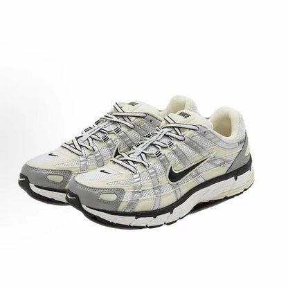Nike P-6000 premium running sneakers in light gray, cream, and black, front view
