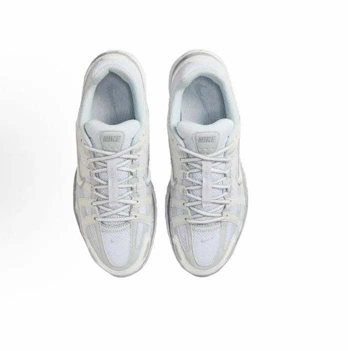 Nike P-6000 Premium sneakers, white pair with lace-up front and blue-gray interior