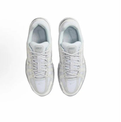 Nike P-6000 Premium sneakers, white pair with lace-up front and blue-gray interior