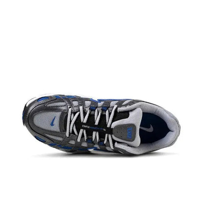 Running sneaker toe and laces view with blue lining, gray mesh upper