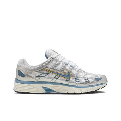White and blue sneakers with lace-up front and gold Nike Swoosh detail
