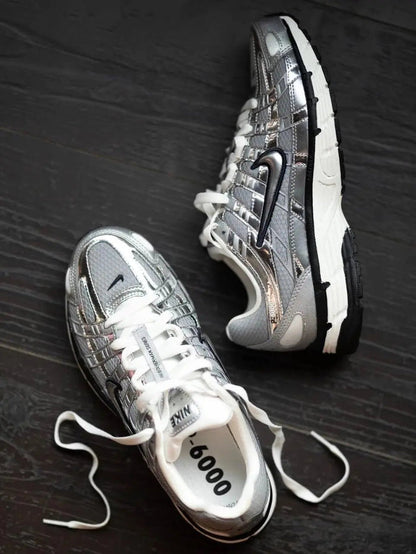 Nike P-6000 Premium sneakers, angled close-up of laces and silver panels