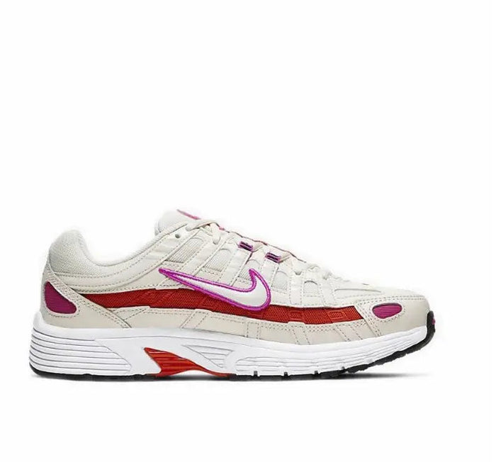 White running sneaker side profile with purple swoosh and red accent at midsole