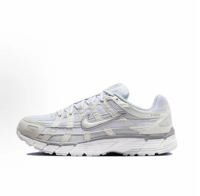 Nike P-6000 Premium sneakers, white with light blue accents, side profile view