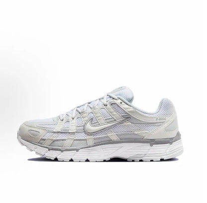 Nike P-6000 Premium sneakers, white with light blue accents, side profile view