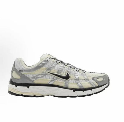 Nike P-6000 premium sneaker in light gray and cream with black swoosh, side
