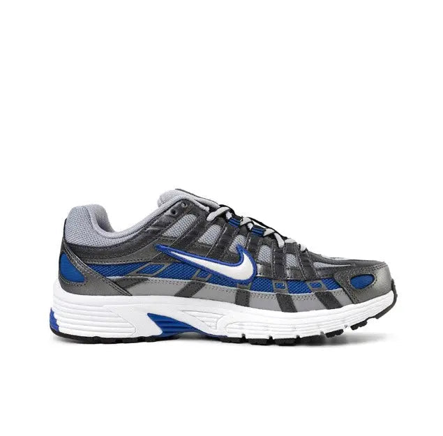 Running sneaker side profile in gray with blue swoosh, black grid overlays