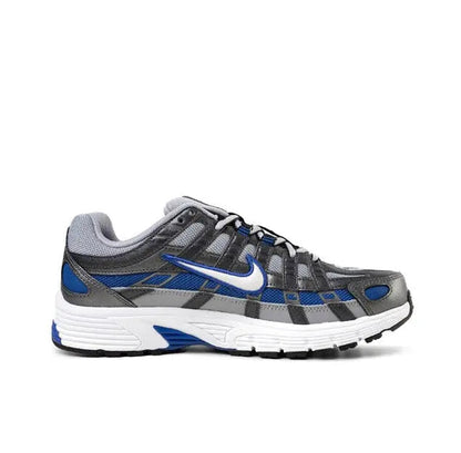 Running sneaker side profile in gray with blue swoosh, black grid overlays