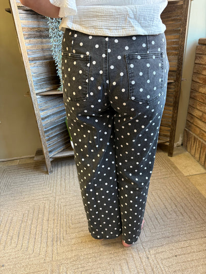 Dark polka-dot jeans with front pockets and waistband, button-and-zip fly