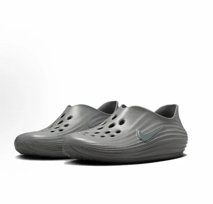 Grey slip-on clogs pair with perforated toe holes and curved ridges