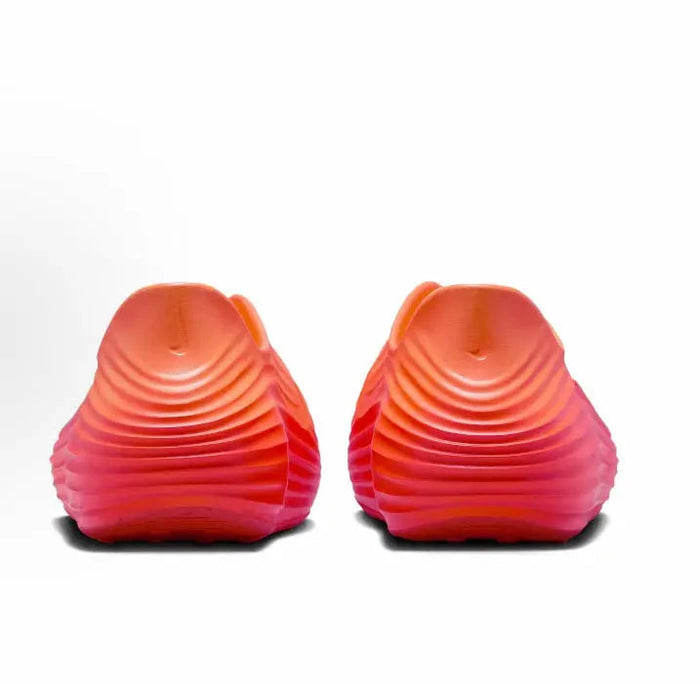Nike ReactX Rejuven8 orange clogs rear view with textured heel ridges