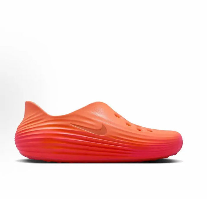 Nike ReactX Rejuven8 orange slip-on clog side view with vent holes