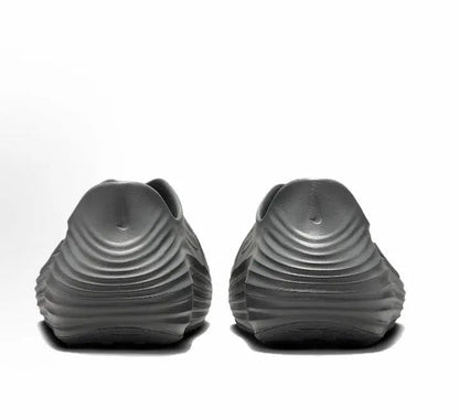 Grey slip-on clogs back view with heel ridges and logo accents