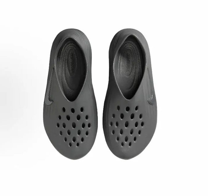 Grey clog pair with perforated upper and open heel openings