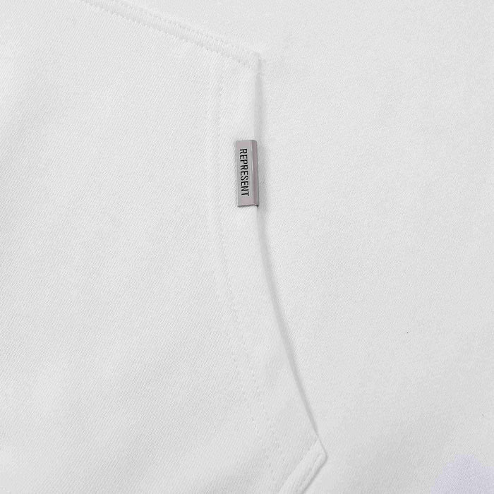 White hoodie fabric with vertical Represent logo label near seam