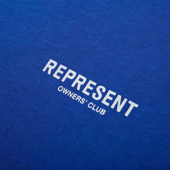 Blue T-shirt with large “REPRESENT OWNERS' CLUB” front graphic