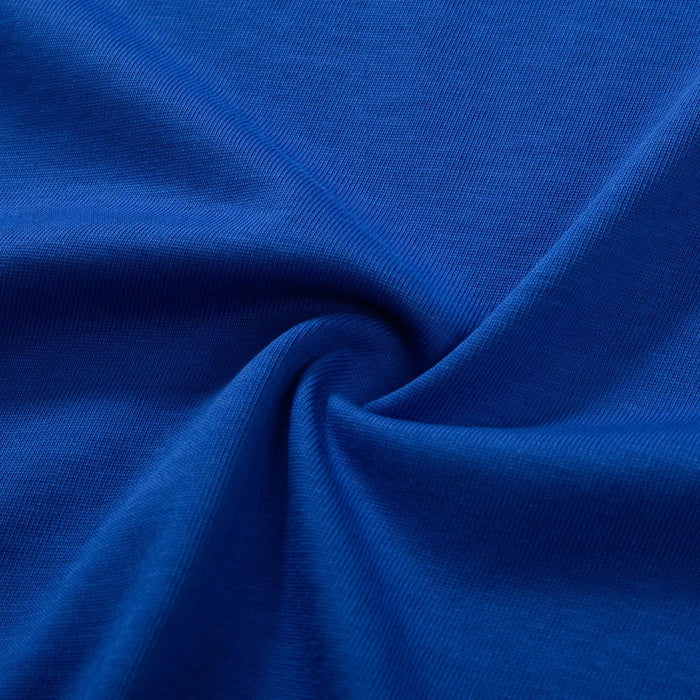 Blue cotton T-shirt fabric close-up with drape texture
