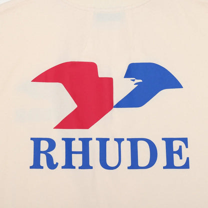 Cream T-shirt chest logo graphic in red and blue