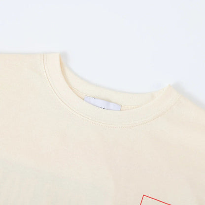 Beige crewneck T-shirt collar with ribbed trim and part of interior label