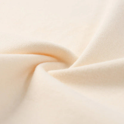 Beige cotton T-shirt fabric texture close-up