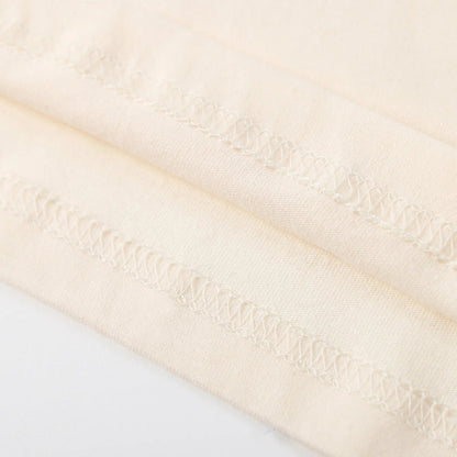 Beige T-shirt hem stitching detail