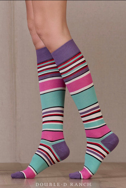 Serape striped crew socks by Double D Ranch in purple, pink, and teal, on feet