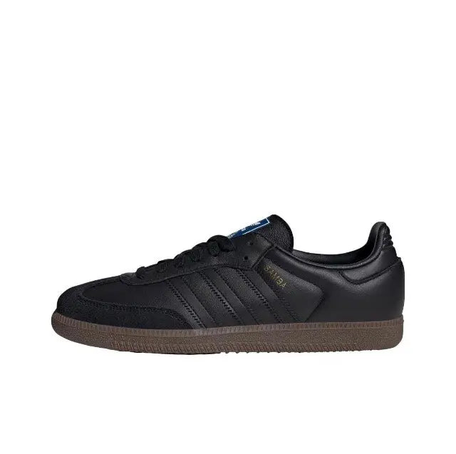 Adidas Samba OG sneakers in black leather with gum-brown rubber sole, side view