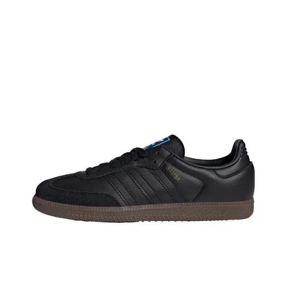 Adidas Samba OG sneakers in black leather with gum-brown rubber sole, side view