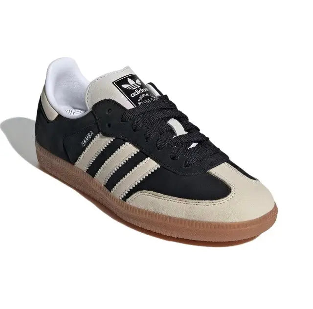 Adidas Samba OG sneakers with black upper, cream toe, and gum sole