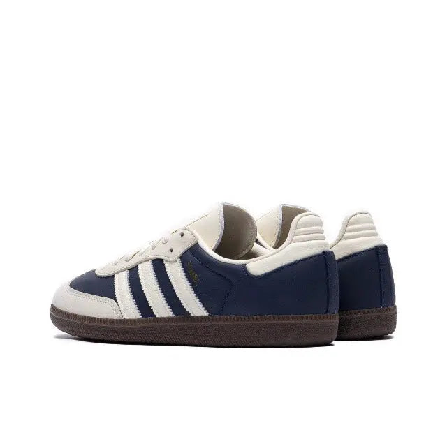 Adidas Samba OG sneakers with navy quarter panels, white stripes, low sole