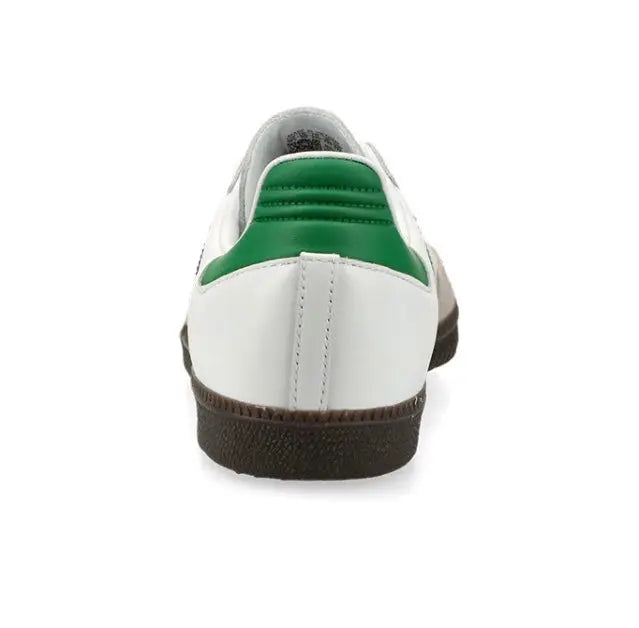 Low-top sneakers heel in white with green collar and dark rubber sole