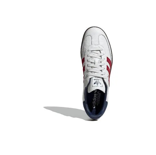 Adidas Samba OG sneaker, white upper with red stripes and navy inner lining, front view