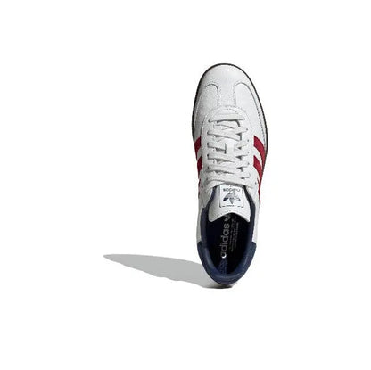 Adidas Samba OG sneaker, white upper with red stripes and navy inner lining, front view