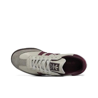 Adidas Samba OG sneakers side view with white laces, cream leather, burgundy accents