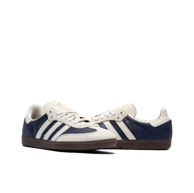 Adidas Samba OG sneakers side view with navy and white three-bar stripes