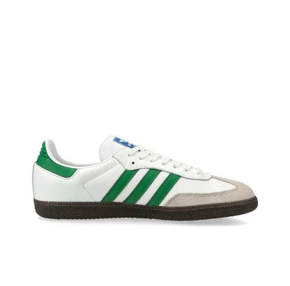 Low-top sneakers side view in white with green stripes and dark gum sole