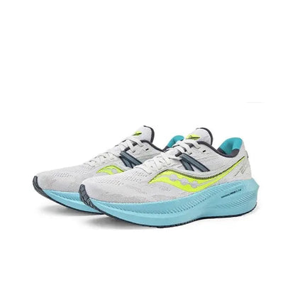 Pair of light gray running shoes with neon yellow accents and light blue midsoles