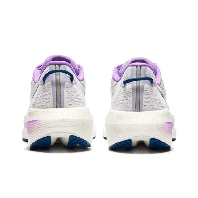 Pair of white running shoes with purple heel tabs and indigo accents