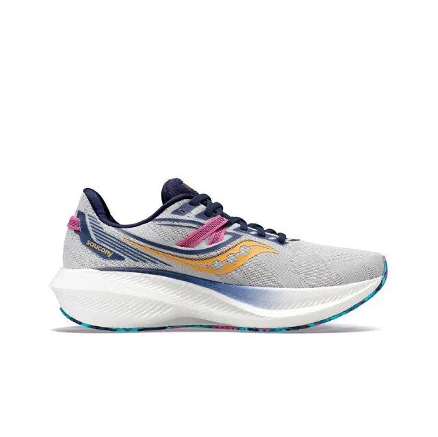 Light gray running shoe with navy accents, gold swoosh, pink lace tab, cushioned sole