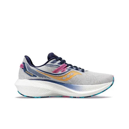 Light gray running shoe with navy accents, gold swoosh, pink lace tab, cushioned sole